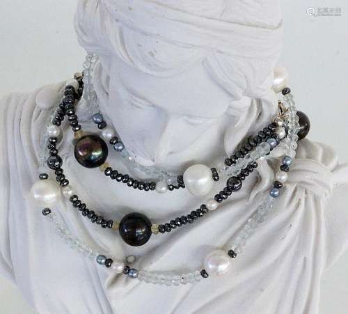 TWO NECKLACES with black and white pearls of