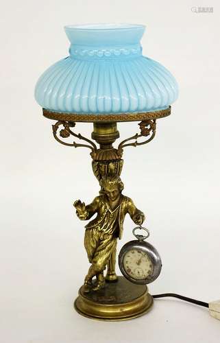 A FIGURE TABLE LAMP WITH CLOCK STAND France circa