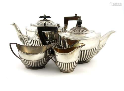 A three-piece silver bachelor's tea set, by The Goldsmiths and Silversmiths Company, Sheffield 1914,