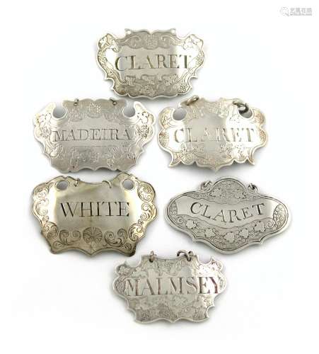A collection of six 18th and 19th century silver wine labels, unmarked, cartouche and shaped