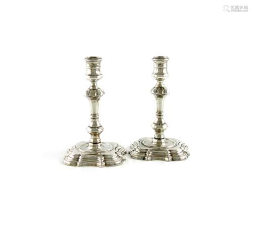 A pair of George II cast silver candlesticks, by James Gould, London 1737, with late Dutch import