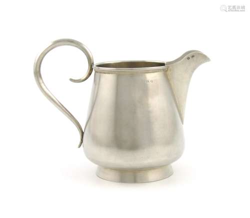 A Russian silver cream jug, 1908-1917, tapering circular form, scroll handle, engraved decoration,