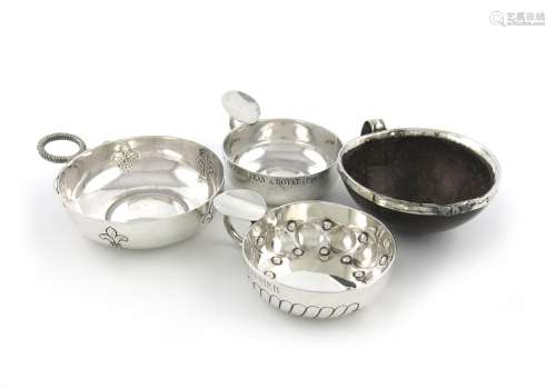 A small collection of four wine tasters, comprising: three French silver ones, circular form,