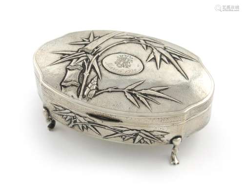 A Chinese silver dressing table box, by Hung Chong, circa 1930's, shaped oval form, the hinged cover