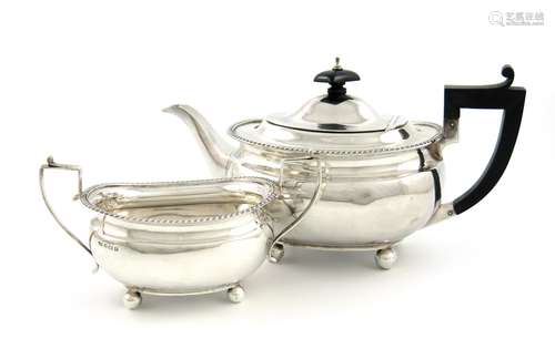 A silver teapot and sugar bowl, by Docker & Burn Ltd, Birmingham 1924 and 1928, oblong bellied form,