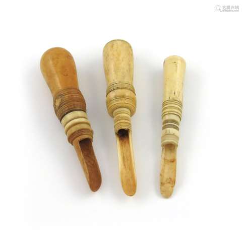 A small collection of three 19th century travelling bone apple corers, turned screw-off handles, one