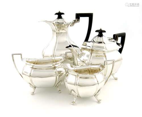 A four-piece silver tea set, by Mappin and Webb, Sheffield 1911, lobed oval baluster form, scroll