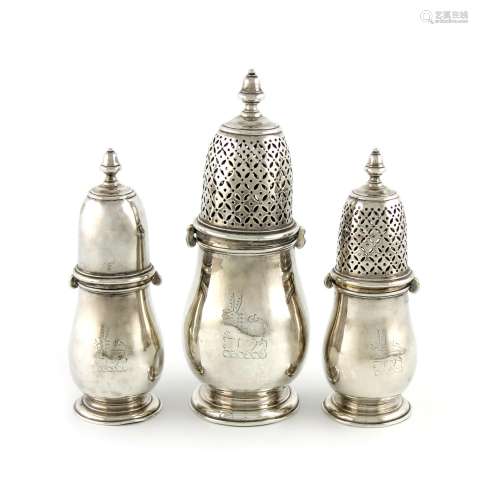 A set of three graduated Queen Anne silver casters, by Edmund Pearce, London 1707, baluster form,