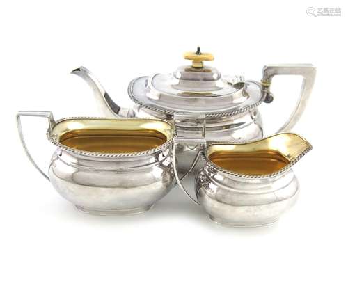 λA three-piece Edwardian silver tea set, by Stevenson & Law, Sheffield 1907, oblong bellied form,