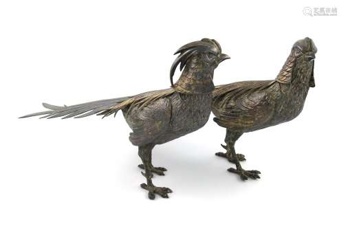 A pair of modern Spanish silver models of pheasants, modelled in standing positions, with textured
