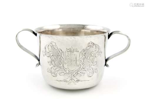 An electroplated two-handled porringer, circular form, reeded scroll handle, the front engraved with