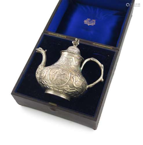 A 19th century Dutch silver tea pot, in the 18th century Frisian manner, pear form, embossed with