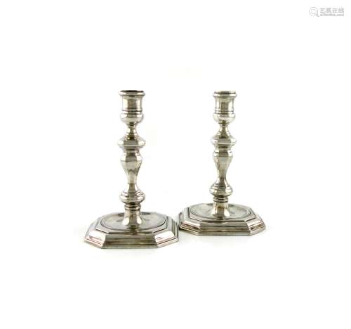 A pair of George II silver candlesticks, by John Le Sage, London 1727, knopped faceted baluster
