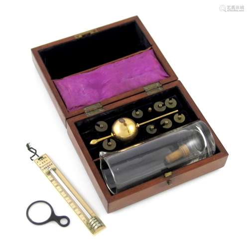 A Sikes pocket hydrometer, in a fitted wooden case, the hinged cover inlaid with an inscribed
