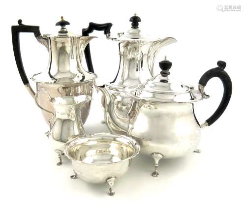 A three-piece silver tea set and similar hot water pot, by R. Pringle, London 1915, the hot water