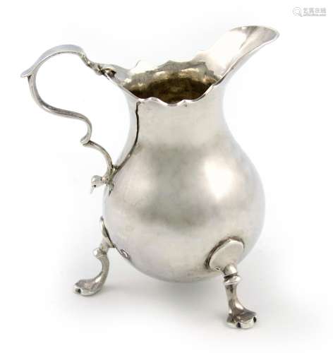 A George II silver cream jug, by Richard Gosling, London 1745, baluster form, scroll handle, wavy-