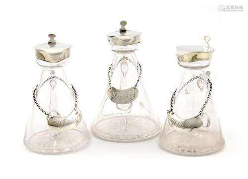 A pair of Edwardian silver whisky tots, maker's mark worn, London 1904, tapering conical form,