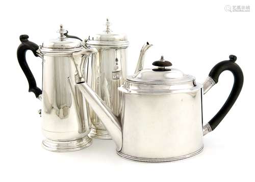 A matched pair of silver café au lait pots, by Holland, Aldwinckle & Slater, London 1911, tapering