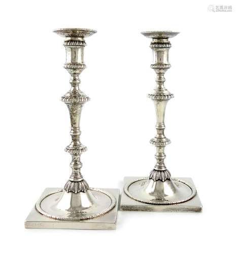 A pair of George III silver candlesticks, by Ebenezer Coker, London 1767, knopped tapering