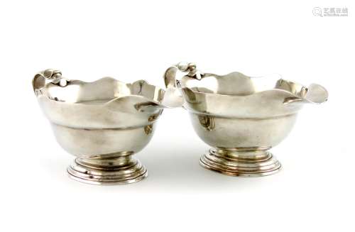 A pair of George II silver sauce boats, by William Paradise, London 1749, oval form, wavy-edge