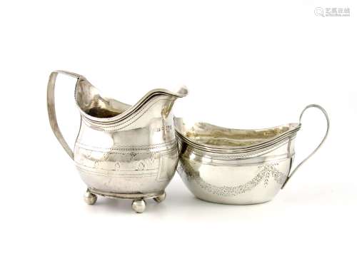 A George III silver cream jug, maker's mark partially worn, London 1812, oblong bellied form,