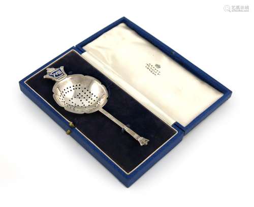 By R. E. Stone for Asprey, a silver and enamel commemorative tea strainer, London 1936, also