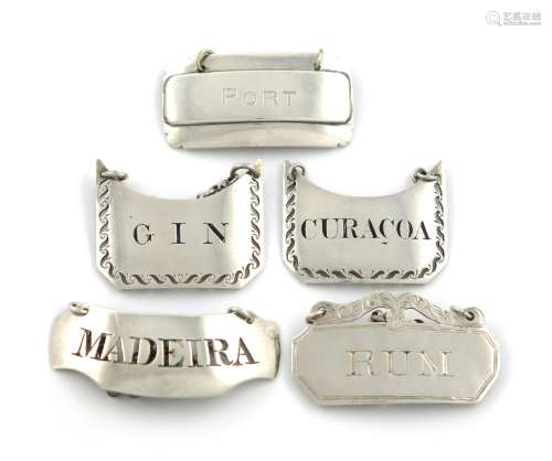 A collection of five antique silver wine labels, various dates and makers, comprising: a Victorian