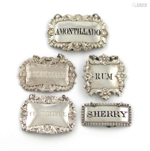 A collection of five antique silver wine labels, various dates and makers, broad rectangular form,