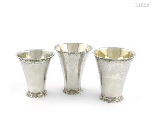 A small collection of three Swedish silver beakers, tapering circular form, gilded bowls,