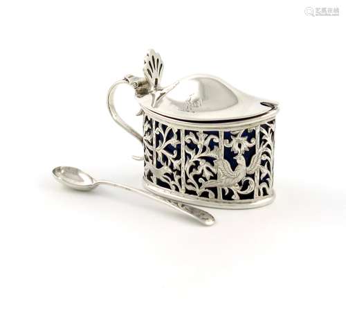 A Victorian silver mustard pot, by Edmond Johnson, London 1895, oval form, pierced and engraved with