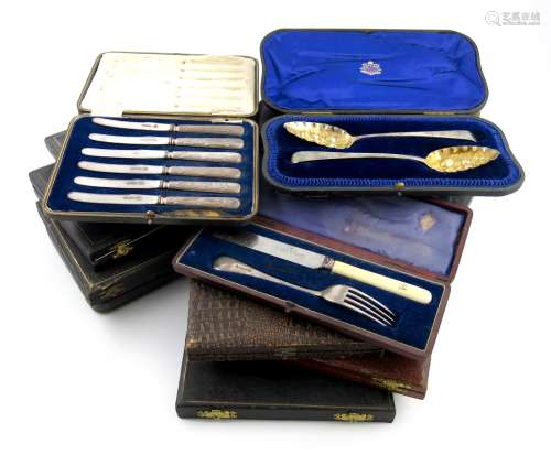λA collection of cased sets of flatware, comprising silver items: a pair of tablespoons with later