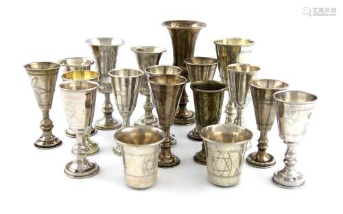A collection of sixteen silver kiddish cups, various dates and makers, baluster and tapering