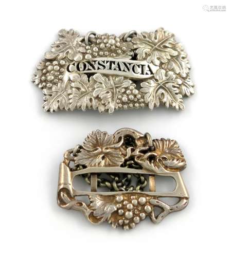 An early 19th century silver wine label, unmarked, vine form, pierced 'CONSTANCIA', plus a George IV