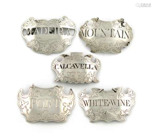 A collection of five 18th century silver wine labels, various makers, cartouche form, chased vine