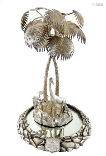 A Victorian electroplated epergne, modelled as two intertwined palm trees on a rocky base, mounted