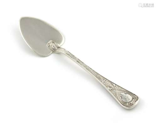 A Victorian silver butter spade, by Francis Higgins, London 1865, chased decoration, with a crest,
