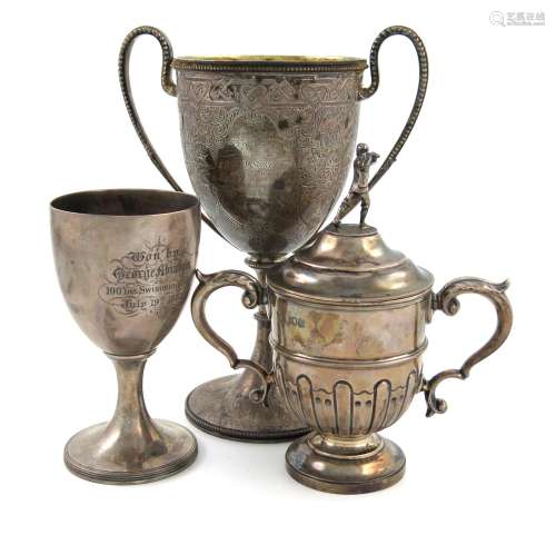 A mixed lot of silver trophy cups, comprising: a Victorian two-handled cup, by The Barnards,