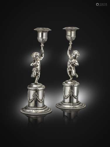 A pair of silver figural candlesticks, with cancelled marks and London Assay Office marks for London