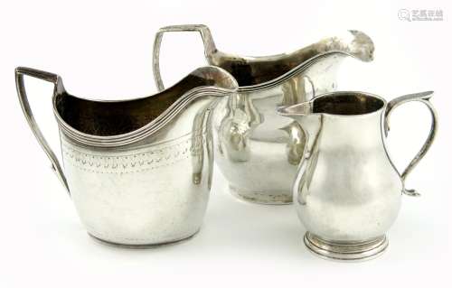 A mixed lot of three silver cream jugs, comprising: a George III provincial one, by Joseph Hicks, of