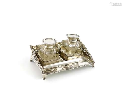 An Edwardian silver inkstand, by H. Matthews, Birmingham 1912, rectangular form, pierced foliate