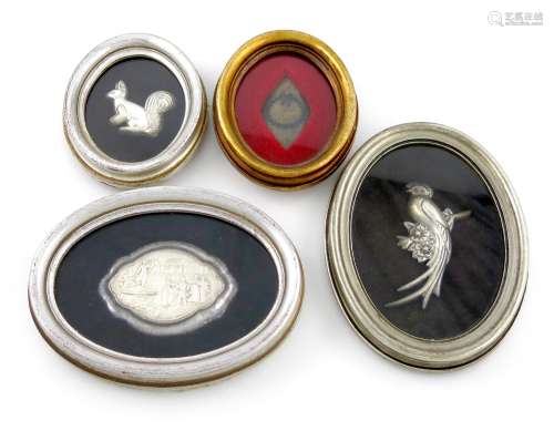 λA mixed lot, comprising: a framed silver snuff box lid, with figural decoration, a framed white
