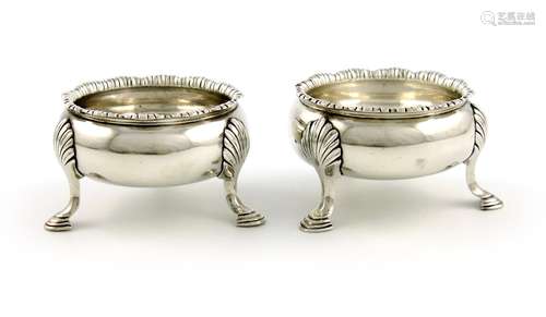 A pair of George II silver salt cellars, maker's mark I.W, unidentified, London 1757, plain circular