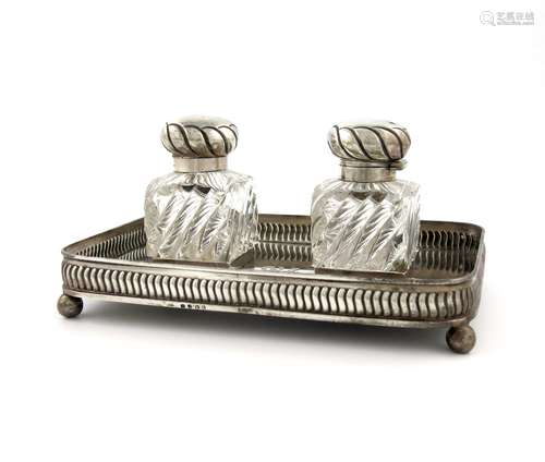 A George III silver inkstand, Henry Northcote, London 1808, rounded rectangular form, fluted