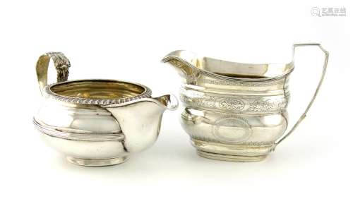 A George III silver cream jug, no apparent maker's mark, London 1804, oblong bellied form, scroll