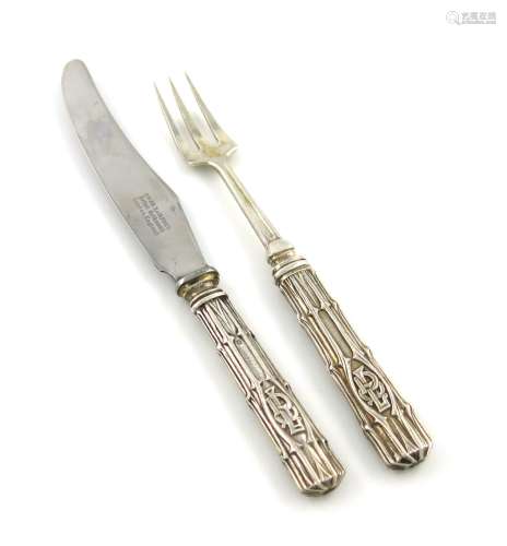 By Omar Ramsden, an Arts and Crafts silver knife and fork, London 1932, textured tapering handles