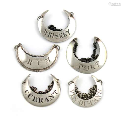 A small collection of five silver crescent shaped wine labels, various dates and makers, incised '