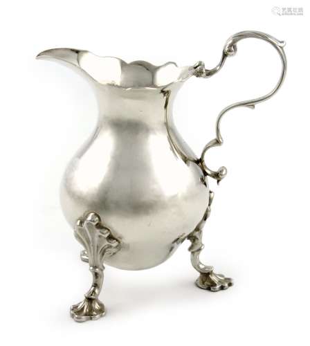 A George II silver cream jug, by Fuller White, London 1756, baluster form, leaf capped scroll