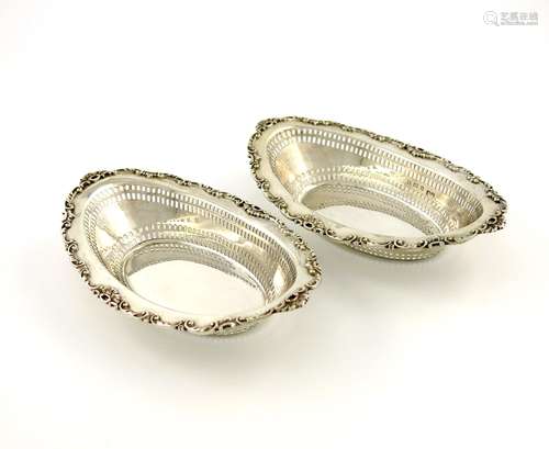 A pair of Edwardian silver bonbon dishes, by H. Matthews, Birmingham 1903, oval form, pierced with