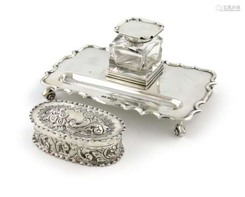 A silver inkwell, by Walker and Hall, Sheffield 1924, shaped rectangular form, moulded border,