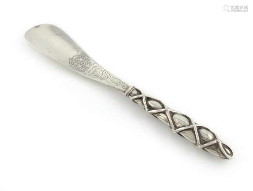 An Edwardian silver Arts and Crafts silver shoe horn, Birmingham 1902, maker's mark partially lost